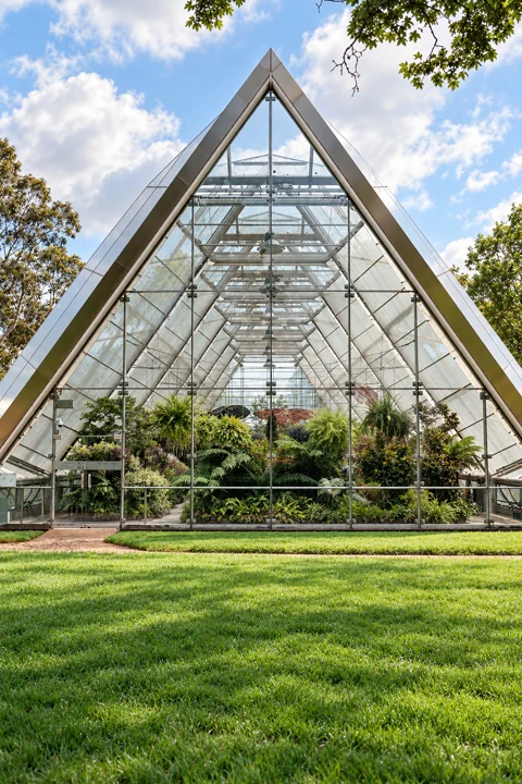 The glass-fronted Robert Clark Conservatory in Ballarat Botanical Gardens