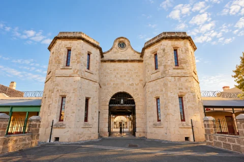 The limestone gatehouse, clock and central arch of Fremantle Prison