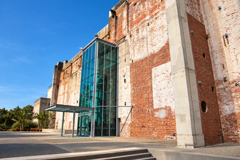 The brick exterior and glass entrance at Brisbane Powerhouse