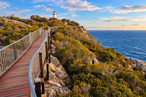 The coastal boardwalk and lighthouse at Cape Tourville in Freycinet National Park