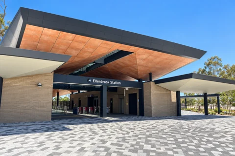 Ellenbrook Station entrance beneath an angular copper-toned canopy