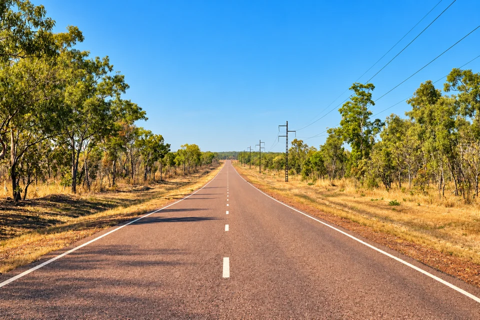 The Arnhem Highway through tropical woodland at Marrakai